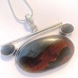 1 1/2 inch. X 2 inch, Iron Tiger Eye and Black Onyx pendant on a silver chain